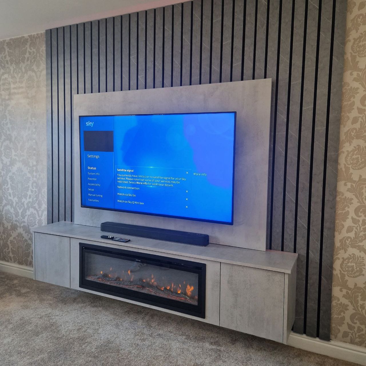 Media wall build with lighting and storage features